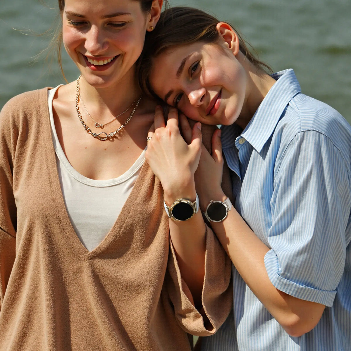 Two women wearing Runmefit GRACE watches by the lake.